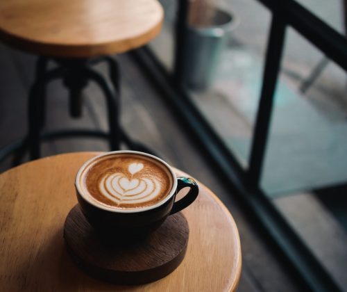 coffee latte on the wood desk in cafe